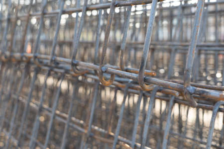 The rebar is bonded with steel wire for use as a construction infrastructure. Which part of the rebar has rusted due to chemical reactions.の写真素材