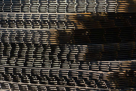 The rebar is bonded with steel wire for use as a construction infrastructure. Which part of the rebar has rusted due to chemical reactions.の写真素材
