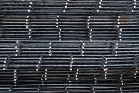 The rebar is bonded with steel wire for use as a construction infrastructure. Which part of the rebar has rusted due to chemical reactions.の写真素材