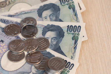 Japanese yen banknotes management for exchange and trading. Manage salaries, income, and expenses to be balanced. Financial, investment, and saving money after retirement concepts.の写真素材