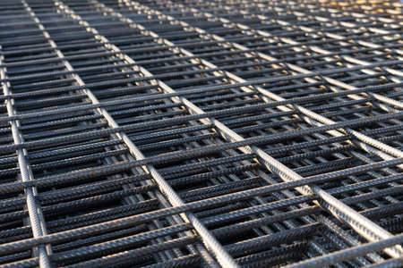 The rebar is bonded with steel wire for use as a construction infrastructure. Which part of the rebar has rusted due to chemical reactions.の写真素材