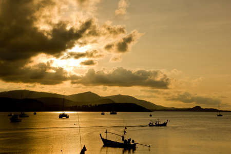fishing boat on the sea after sunset
