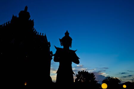 silhouette of legend giant statue in the templeの写真素材