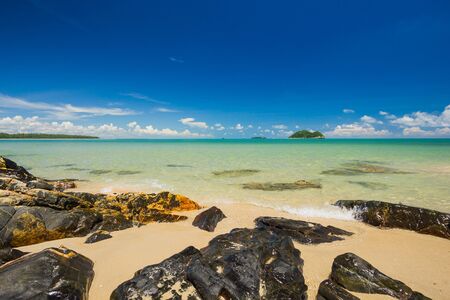The rock at beach on Blue skyの写真素材