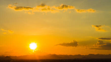 Sunset background over the mountainの写真素材