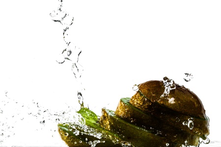 Water splash on kiwi fruit isolated on white backgroundの写真素材
