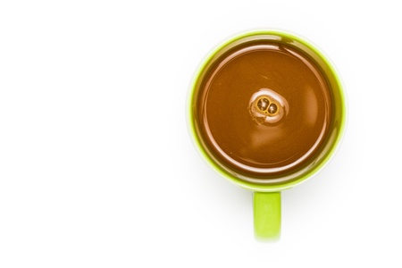 Top view of coffee in cup on white backgroundの写真素材