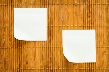 yellow paper note and bamboo plate backgroundの写真素材