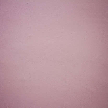 Pink dirty concrete wall background textureの写真素材