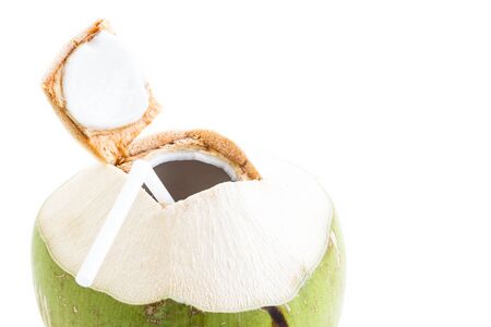 Close up of fresh coconut water drink on white backgroundの写真素材