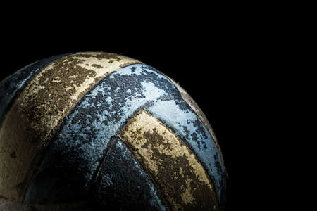 Old volleyball on dark backgroundの写真素材