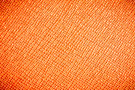 Orange textured leather backgroundの写真素材
