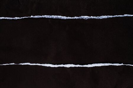 Ripped black paper with spaceの写真素材