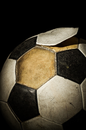 Close up of Old Soccer ball on Black backgroundの写真素材