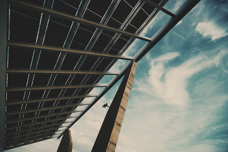 Wide angle view from bottom of modern hi-tech solar photovoltaic panel with empty space for your message on the right, huge solar battery, giant energy producing structure, Barcelona, Spainの写真素材