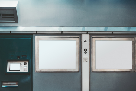 The mock-up of an urban electronic counter on a public transport stop: templates of two rectangular LCD screens for map and information, payment terminal for buy tickets, SOS intercomの写真素材