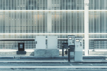 Two modern electronic turnstiles with blank screens at the exit from the arrivals area at the...