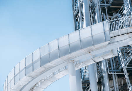 A close-up view of a contemporary construction of an industrial oil refinery or a modern fuel...