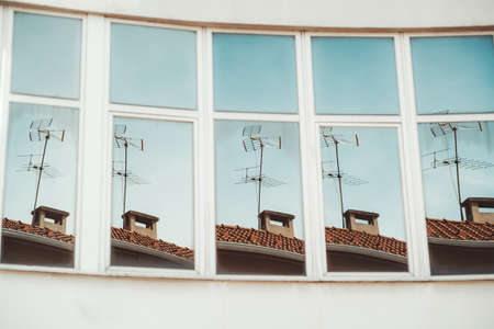 A row of vertical mirror window sections reflecting the same stuff with a slightly different angle:...