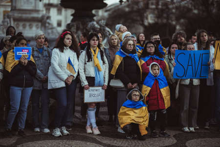 Lisbon, Portugal - April 20, 2022: a demonstration dedicated to saving the city of Mariupol which was attacked and destroyed by Russian militaries during the incursion on Ukraine; a row of protestersのeditorial素材