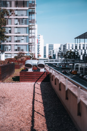 The vertical shot from this elevated position, the view overlooks an architecturally striking street, showcasing the modern design in an urban setting and contemporary neighborhoodの写真素材