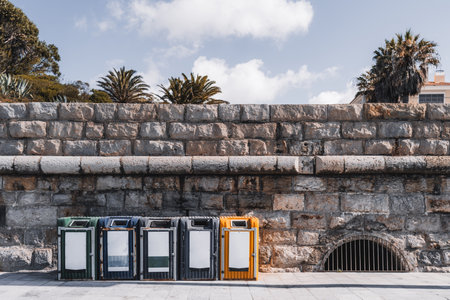 Estoril; A wall made of sandstone eco points, arranged horizontally along the promenade by the sea,...