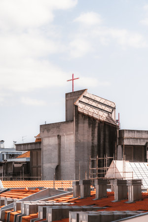 A vertical view of the roof of the parish Roman Catholic church Sagrado Coracao de Jesus belonging to the Lisbon patriarchate with a cross made of metal beams; neoclassical with eclectic elementsの写真素材