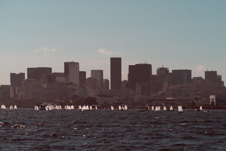 Telephoto view of Rio de Janeiro's Gloria district skyline with plenty of small white sport...