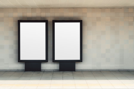 Two blank advertising lightbox mockups on tiled wall in subway corridor, minimalist indoor background with empty poster frames and large copy space area on the rightの写真素材