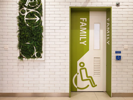 Entrance door of priority public toilet or public restoom for family and people with disability with wheelchair sign at shopping center. Disabled toilet concept.の写真素材