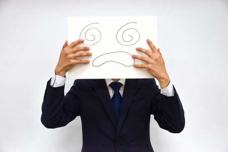 Facial expression of a person made of paperの写真素材