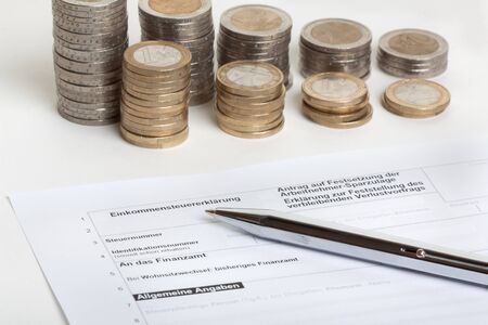 Tax return with biro and savings