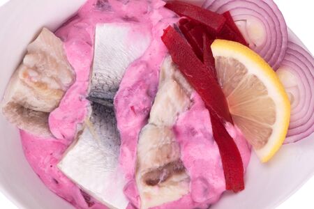 Herring mayonnaise salad with red beet sauceの写真素材