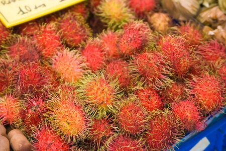 Red hairy Litchi on the marketの写真素材