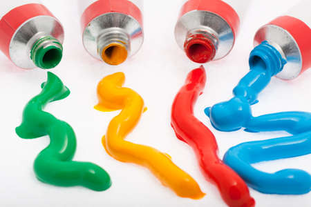 Oil paint from the tube in front of white background