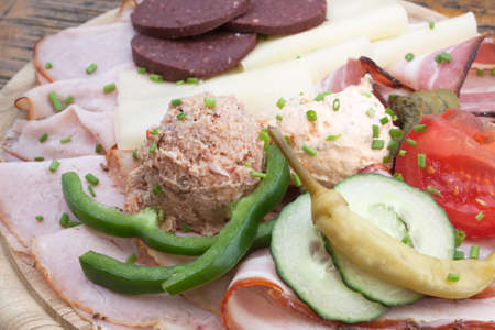 Ham and spread on a cutting boardの写真素材