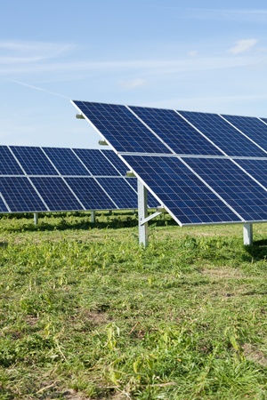 Close up of solar panels on field