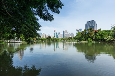Lumphini Park in Bangkok with skyscrapers in the backgroundの写真素材