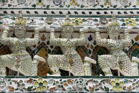 Statues at the Temple of the Dawn Wat Arun in Bangkok