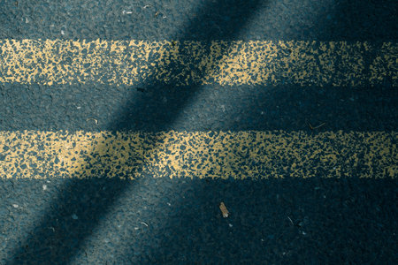 The two yellow lines of a road marking in England