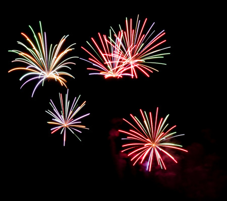 Colorful fireworks on black background at international competition in Montrealの写真素材