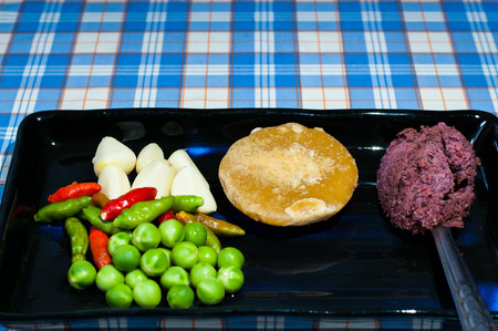 In disk have eggplant chili pepper susar paste and garlic
