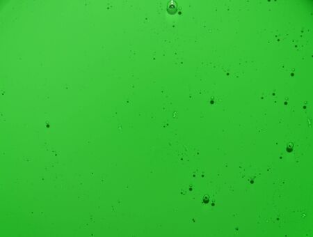 Light green texture of the liquid with bubbles. Green water with bubbles. Closeupの写真素材