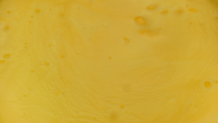 Bright yellow, thick, texture gel with bubbles. Closeupの写真素材