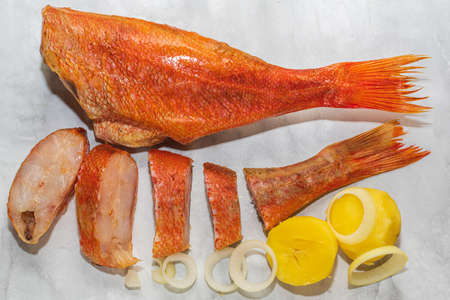 Red smoked perch with boiled potatoes and onion rings