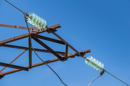 Electricity pylon on blue sky