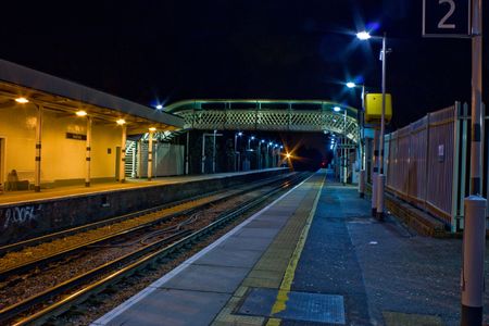 An empty train station taken at nightの写真素材