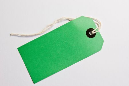 A green luggage label on a white backgroundの写真素材
