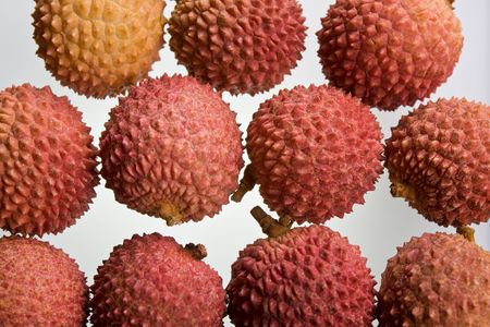 A selection of lychees against a white backgroundの写真素材