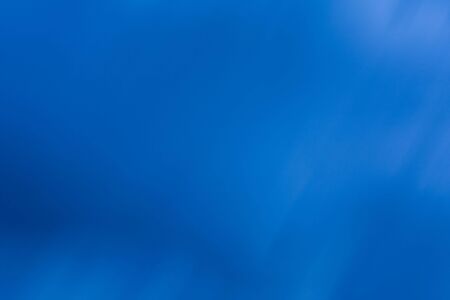 A graduated and mottled royal blue backgroundの写真素材